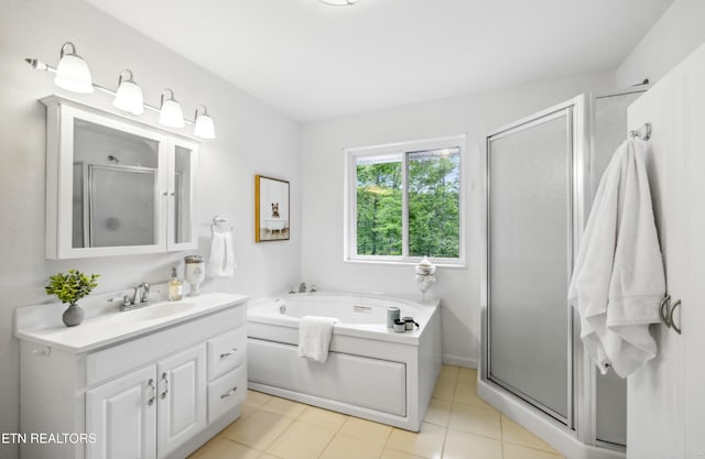 635 Gold Dust Dr, Pigeon Forge, TN 37863 - full bath featuring vanity, a stall shower, a garden tub, and tile patterned flooring