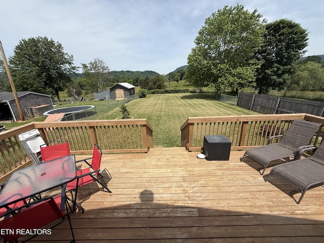 321 Coleman St, Harrogate, TN 37752 - wooden deck featuring a trampoline