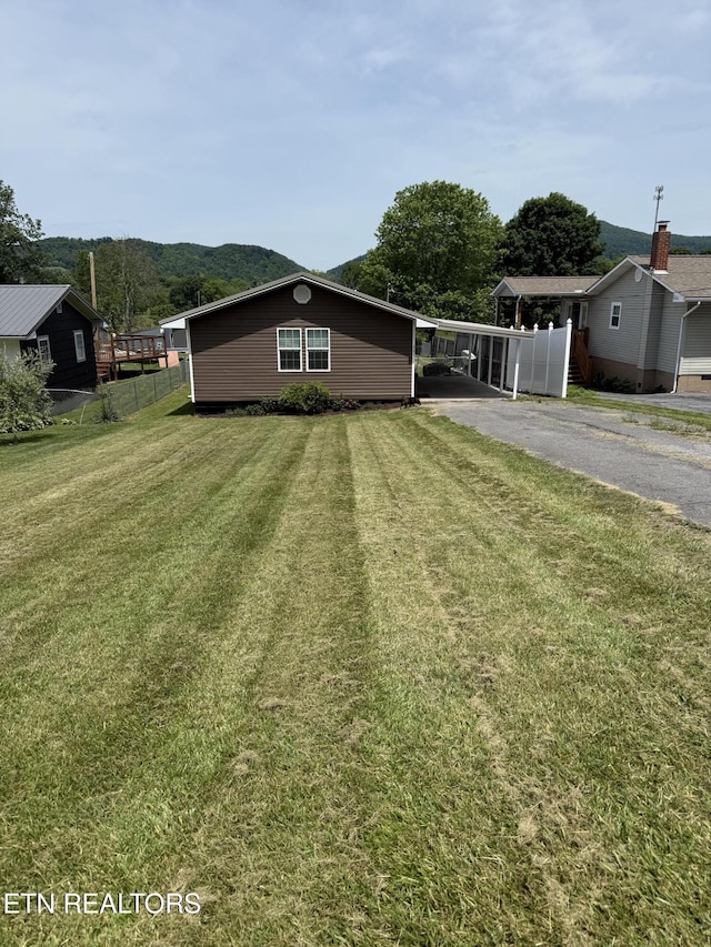 321 Coleman St, Harrogate, TN 37752 - view of yard with asphalt driveway and a carport