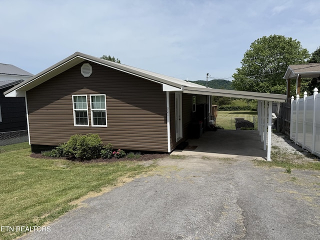 321 Coleman St, Harrogate, TN 37752 - view of home's exterior featuring driveway and a carport