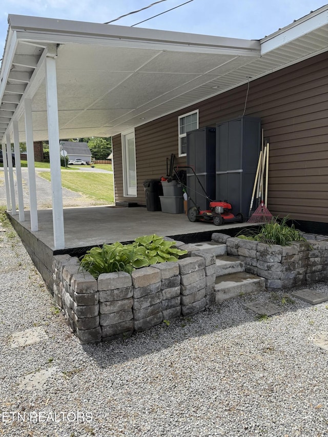 321 Coleman St, Harrogate, TN 37752 - view of patio featuring an attached carport