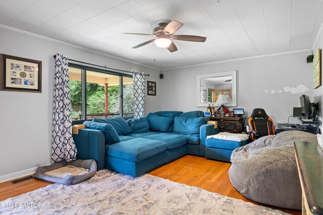 4884 Jones Cove Rd, Cosby, TN 37722 - living room with wood finished floors, a ceiling fan, crown molding, and baseboards