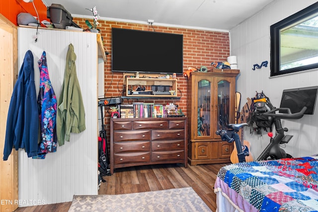 4884 Jones Cove Rd, Cosby, TN 37722 - bedroom featuring wood finished floors, crown molding, and brick wall