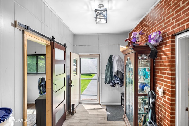 4884 Jones Cove Rd, Cosby, TN 37722 - foyer entrance featuring a barn door, wood finished floors, and crown molding