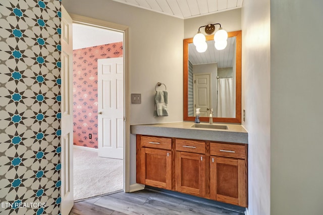 104 Maltese Ln, Oak Ridge, TN 37830 - bathroom featuring wood finished floors, wooden ceiling, vanity, and wallpapered walls