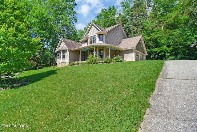 104 Maltese Ln, Oak Ridge, TN 37830 - victorian house with a front lawn, a porch, and driveway