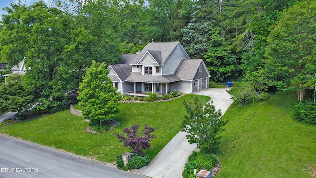 104 Maltese Ln, Oak Ridge, TN 37830 - view of front of home with concrete driveway, a porch, a garage, and a front yard