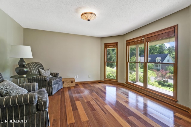 104 Maltese Ln, Oak Ridge, TN 37830 - living area featuring baseboards, wood finished floors, and a textured ceiling