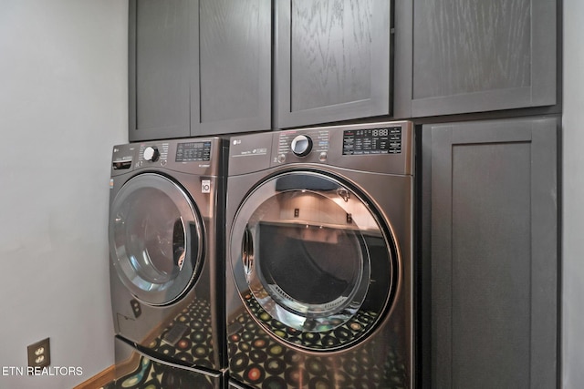 104 Maltese Ln, Oak Ridge, TN 37830 - laundry area with washing machine and clothes dryer, cabinet space, and baseboards