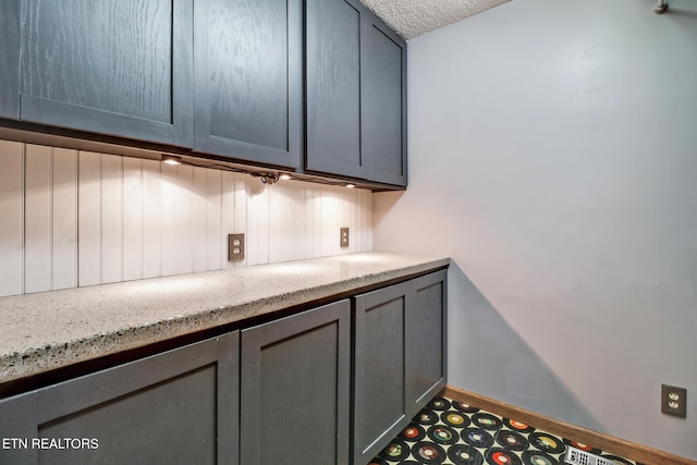 104 Maltese Ln, Oak Ridge, TN 37830 - bar area featuring baseboards and a textured ceiling