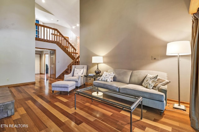 104 Maltese Ln, Oak Ridge, TN 37830 - living area with baseboards, wood finished floors, stairway, a towering ceiling, and recessed lighting