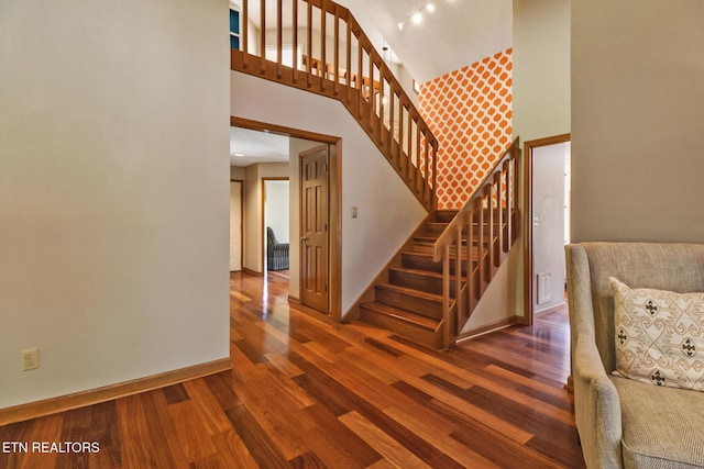 104 Maltese Ln, Oak Ridge, TN 37830 - stairway with wood finished floors, high vaulted ceiling, and baseboards