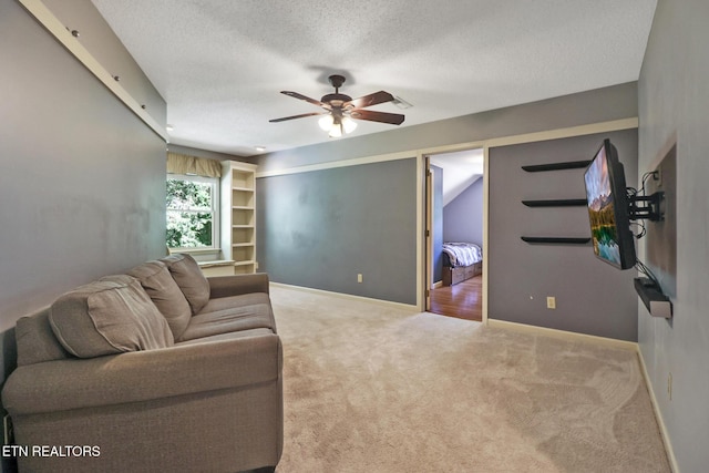 104 Maltese Ln, Oak Ridge, TN 37830 - living room featuring carpet flooring, a textured ceiling, ceiling fan, and baseboards