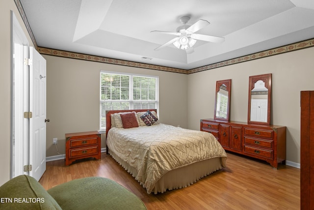 1713 Haley Glenn Ln, Knoxville, TN 37920 - bedroom with a raised ceiling, light wood-style flooring, baseboards, and a ceiling fan