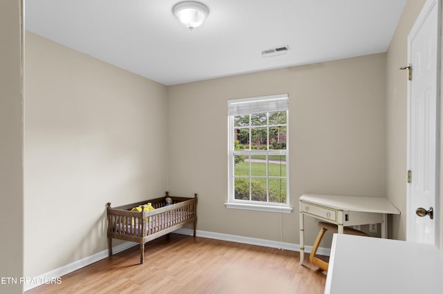 1713 Haley Glenn Ln, Knoxville, TN 37920 - bedroom featuring baseboards, wood finished floors, and a crib
