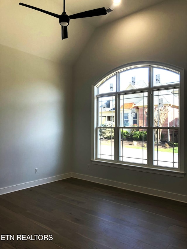 87 Royal Troon Cir, Oak Ridge, TN 37830 - empty room with healthy amount of natural light, ceiling fan, dark wood-style floors, baseboards, and vaulted ceiling