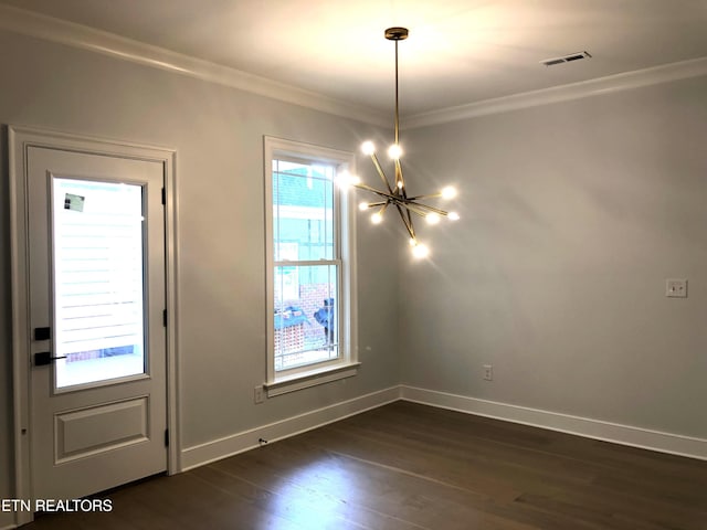 87 Royal Troon Cir, Oak Ridge, TN 37830 - unfurnished dining area with a chandelier, ornamental molding, healthy amount of natural light, dark wood finished floors, and baseboards