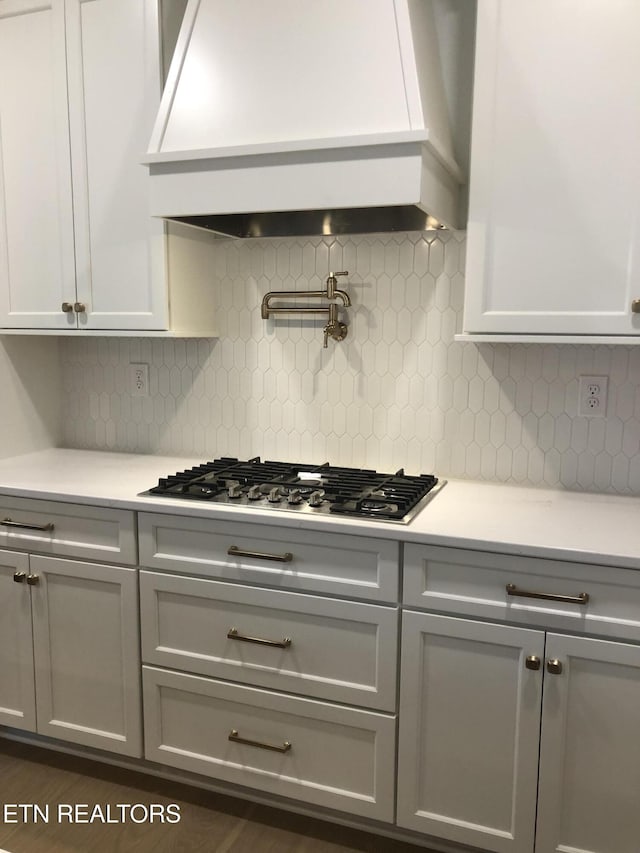 87 Royal Troon Cir, Oak Ridge, TN 37830 - kitchen featuring custom exhaust hood, gray cabinetry, stainless steel gas cooktop, and light countertops