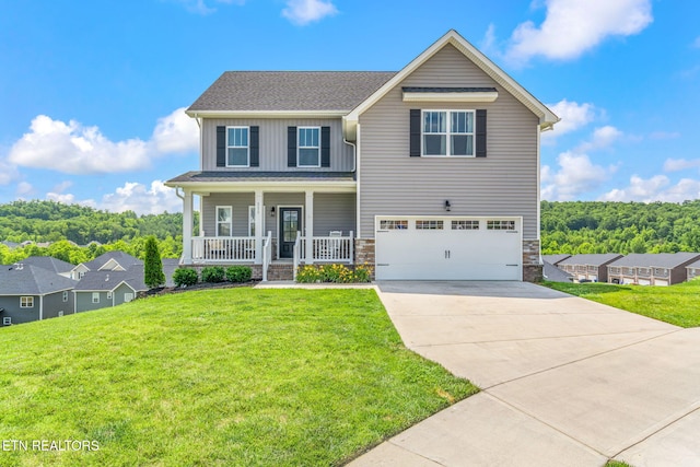 111 Chaseberry Rd, Oak Ridge, TN 37830 - view of front of home featuring covered porch, board and batten siding, driveway, a garage, and a front lawn