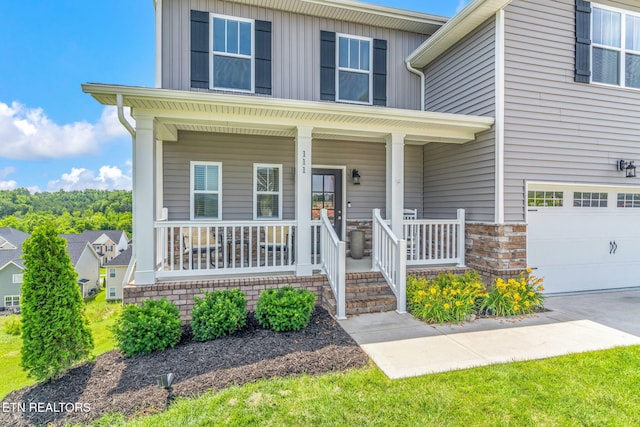 111 Chaseberry Rd, Oak Ridge, TN 37830 - view of front of property featuring covered porch, a garage, and concrete driveway