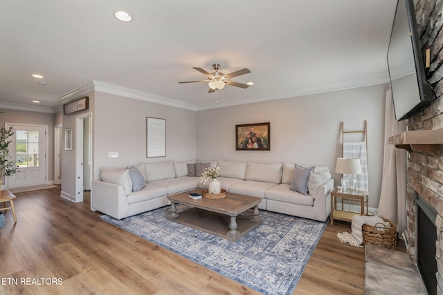 111 Chaseberry Rd, Oak Ridge, TN 37830 - living area with a large fireplace, light wood-type flooring, ceiling fan, recessed lighting, and crown molding