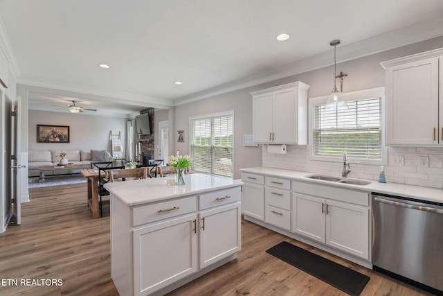 111 Chaseberry Rd, Oak Ridge, TN 37830 - kitchen with dishwasher, ornamental molding, a stone fireplace, tasteful backsplash, and white cabinets