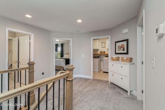 111 Chaseberry Rd, Oak Ridge, TN 37830 - corridor with washer and clothes dryer, an upstairs landing, light carpet, and recessed lighting