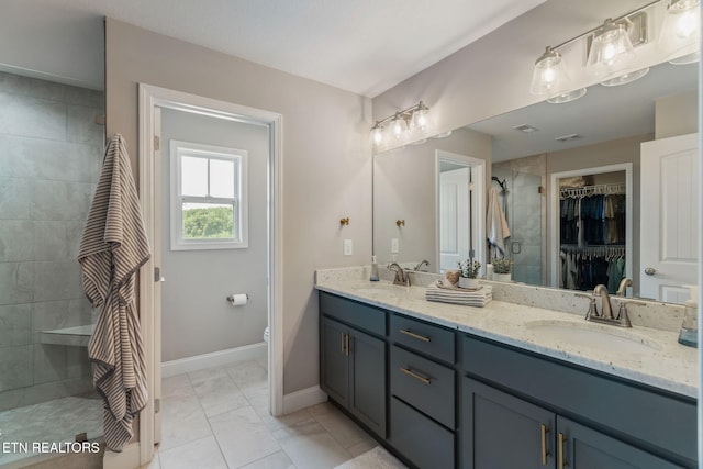 111 Chaseberry Rd, Oak Ridge, TN 37830 - full bathroom featuring double vanity, tiled shower, a spacious closet, and marble look tiles