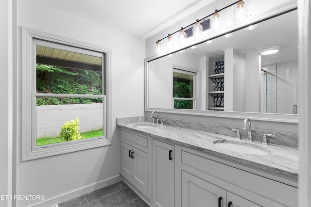120 Kingdom Ln, Walland, TN 37886 - bathroom featuring double vanity, baseboards, a shower with shower door, and tile patterned flooring