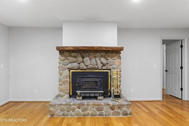 120 Kingdom Ln, Walland, TN 37886 - detailed view of wood finished floors, baseboards, and a fireplace