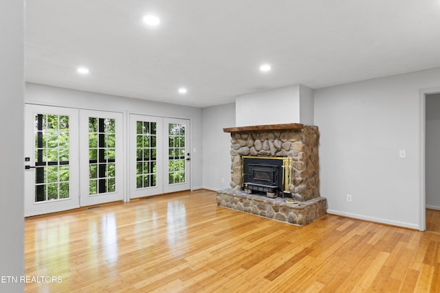 120 Kingdom Ln, Walland, TN 37886 - unfurnished living room featuring wood finished floors, recessed lighting, baseboards, and a wood stove