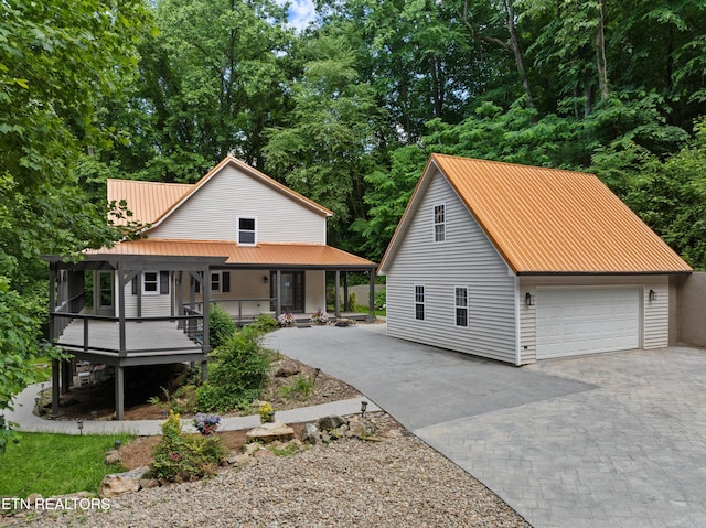 120 Kingdom Ln, Walland, TN 37886 - view of front facade featuring covered porch, a detached garage, and metal roof