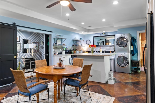 120 Kingdom Ln, Walland, TN 37886 - dining area with stacked washing machine and dryer, ceiling fan, a barn door, and recessed lighting