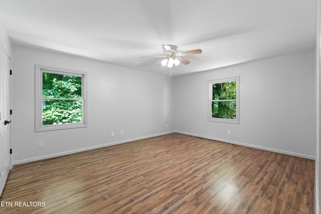 120 Kingdom Ln, Walland, TN 37886 - unfurnished room with healthy amount of natural light, wood finished floors, and ceiling fan