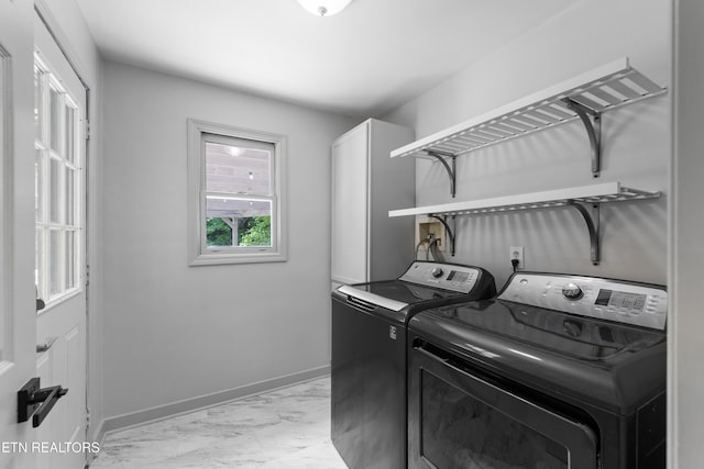 120 Kingdom Ln, Walland, TN 37886 - laundry area with separate washer and dryer, light marble finish floors, cabinet space, and baseboards