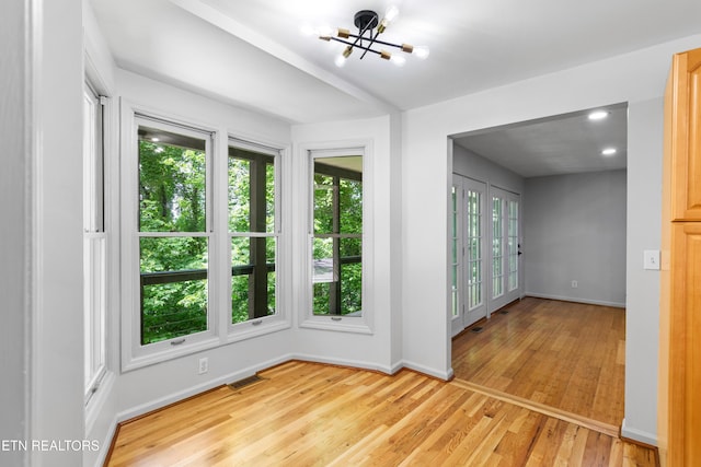 120 Kingdom Ln, Walland, TN 37886 - empty room with a chandelier, light wood finished floors, and baseboards