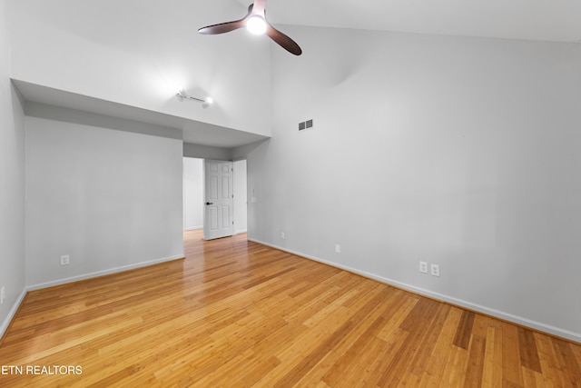 120 Kingdom Ln, Walland, TN 37886 - unfurnished room featuring ceiling fan, high vaulted ceiling, baseboards, and light wood-style flooring