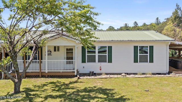 1159 Ditney Ln, Sevierville, TN 37876 - view of front of property featuring covered porch, a front lawn, and metal roof