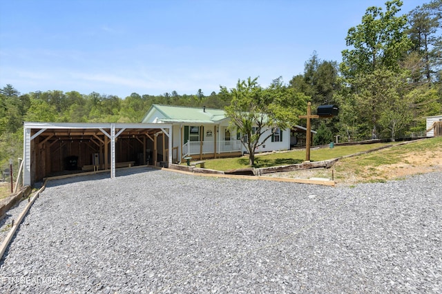1159 Ditney Ln, Sevierville, TN 37876 - single story home featuring driveway, metal roof, a carport, and covered porch