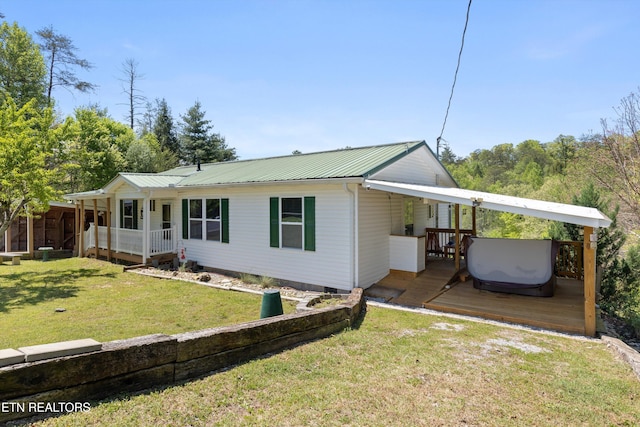 1159 Ditney Ln, Sevierville, TN 37876 - view of front facade featuring a porch, metal roof, a front yard, and crawl space