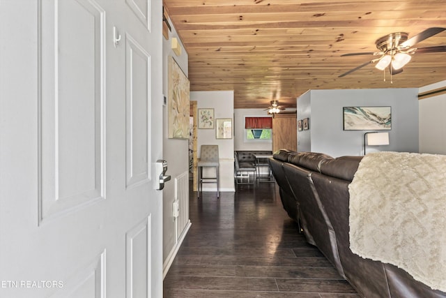 1159 Ditney Ln, Sevierville, TN 37876 - living room with a ceiling fan, wooden ceiling, dark wood-style flooring, and baseboards