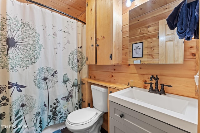 1159 Ditney Ln, Sevierville, TN 37876 - full bath featuring toilet, wooden walls, vanity, wood ceiling, and a shower with curtain