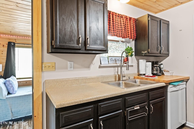 1159 Ditney Ln, Sevierville, TN 37876 - kitchen with dishwasher, wood ceiling, a sink, light countertops, and dark brown cabinetry