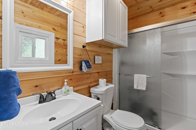 1159 Ditney Ln, Sevierville, TN 37876 - bathroom with a shower stall, wooden walls, vanity, and toilet