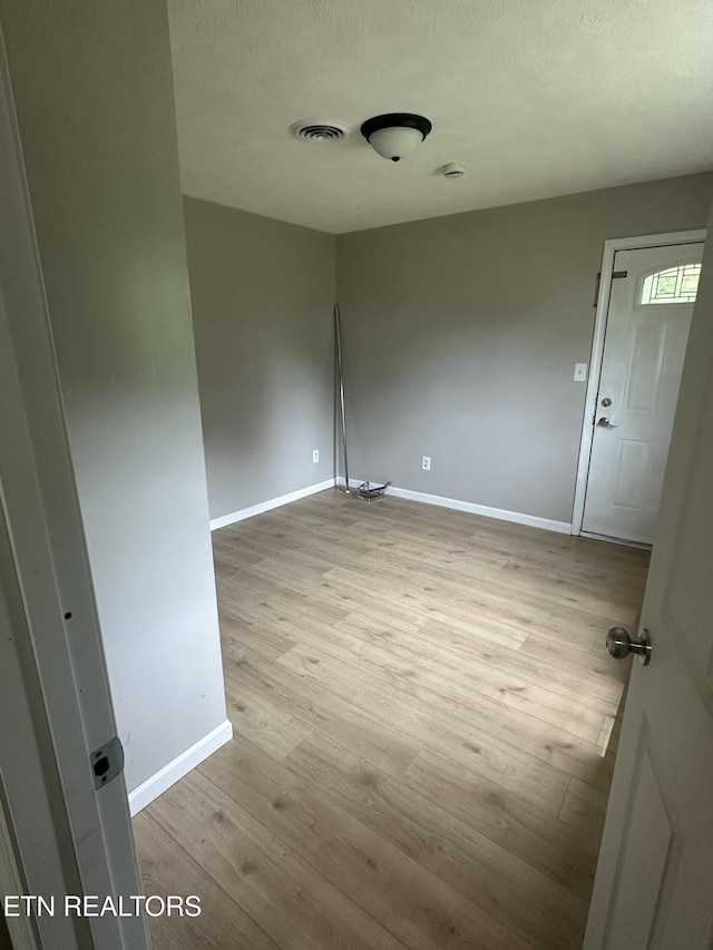 1059 Hale Rd, Dandridge, TN 37725 - spare room featuring baseboards, wood finished floors, and a textured ceiling