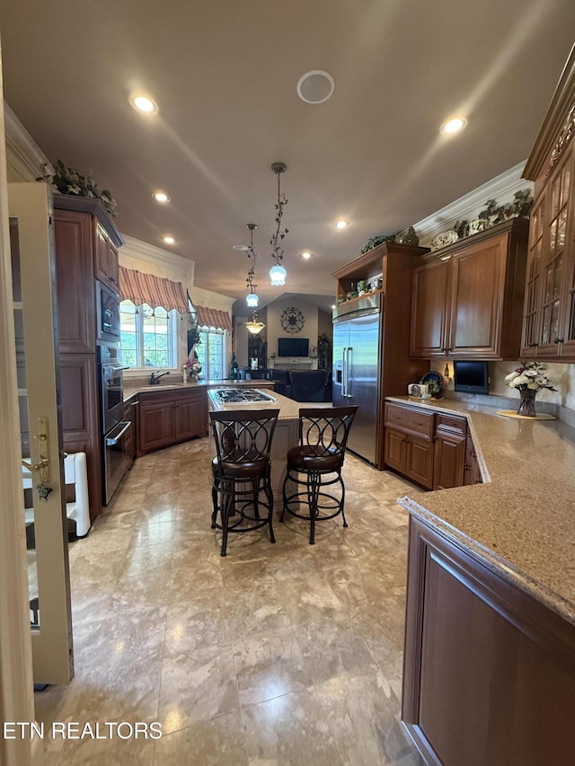 109 Divot Pl, Tazewell, TN 37879 - kitchen with built in appliances, a center island, crown molding, a breakfast bar area, and recessed lighting