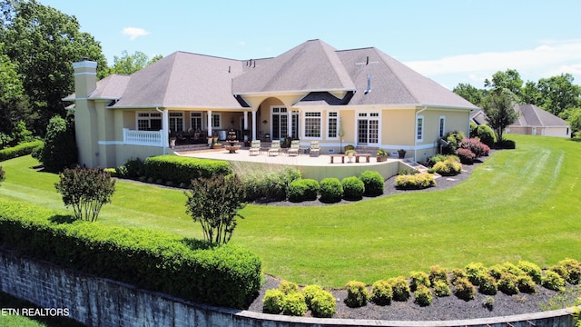 109 Divot Pl, Tazewell, TN 37879 - rear view of property with a patio area, a yard, a chimney, and stucco siding