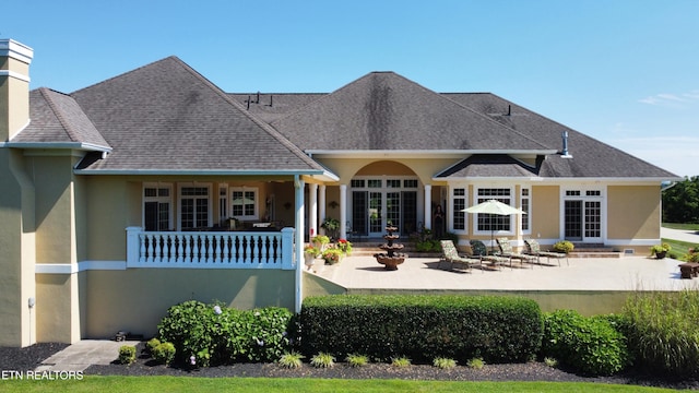 109 Divot Pl, Tazewell, TN 37879 - rear view of property with stucco siding, a patio area, roof with shingles, and a chimney