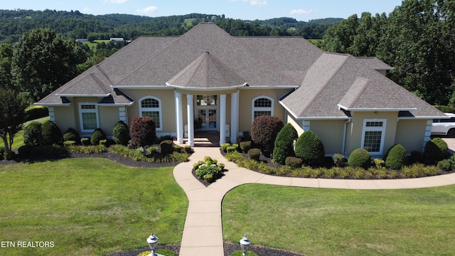 109 Divot Pl, Tazewell, TN 37879 - view of front facade with french doors, stucco siding, a front yard, and roof with shingles