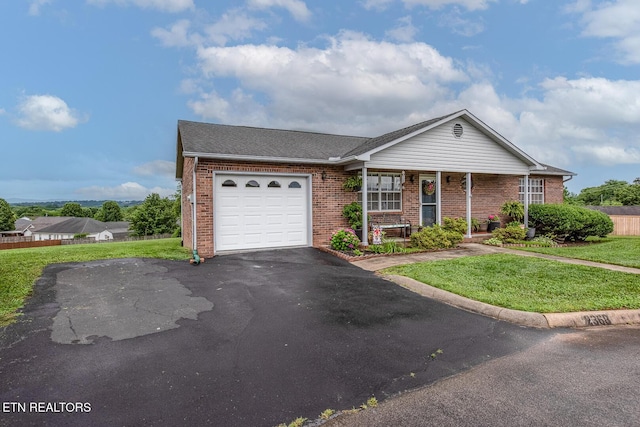 2368 Governors Ct, Maryville, TN 37801 - single story home with brick siding, a front yard, a garage, driveway, and covered porch